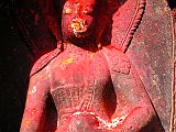 Kathmandu Boudhanath 07-2 Ratnasambhava Statue Closeup A statue of Ratnasambhava glows in the afternoon sun at the Boudhanath Stupa near Kathmandu. Ratnasambhava is the Dhyani Buddha of the south, is yellow, with his right hand in the mudra of generosity while his left hand holds the ratna or wish-fulfilling jewel.